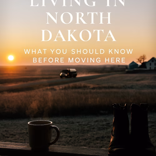 Sunrise over a quiet North Dakota road with a water truck in the distance, a steaming mug and worn boots on a porch railing in the foreground. Text overlay reads: ‘Why I Love Living in North Dakota – What You Should Know Before Moving Here.’”